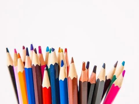 Pile of colored pencils close up in creative concept copy space Stock Photos