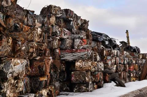 A pile of compressed cars in blocks for processing Stock Photos