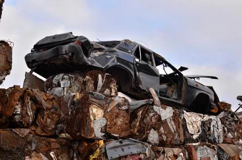 A pile of compressed cars in blocks for processing Stock Photos