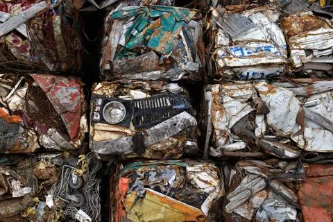 A pile of compressed cars in blocks for processing Stock Photos