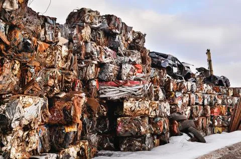 A pile of compressed cars in blocks for processing Stock Photos
