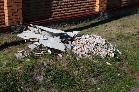 Pile of Construction Debris and Broken Concrete on Grass Stock Photos