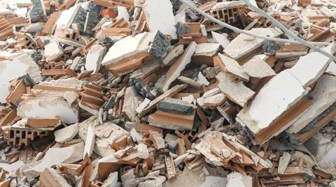 Pile of construction waste after wall demolition in an apartment during remod Stock Photos