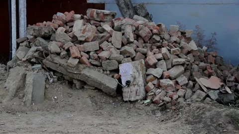 Pile of construction waste from bricks on the edge of the road Vídeos de archivo 112104735