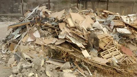 A pile of construction waste at a construction site. Aerial view. Reconstruction Stock Footage 163124786