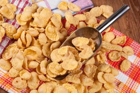 Pile of cornflakes and scoop Stock Photos