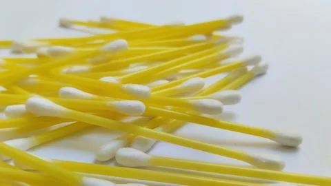 A pile of cotton buds on a white background Stock Footage 312909120