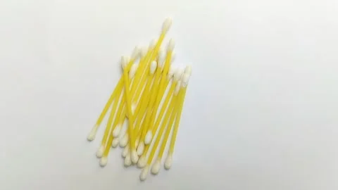 A pile of cotton buds on a white background Stock Footage 312909122