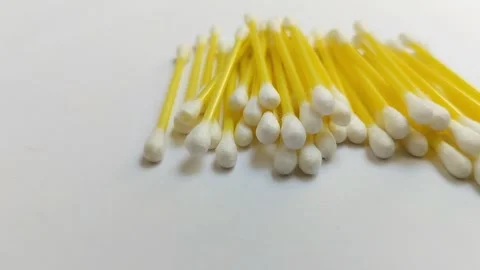 A pile of cotton buds on a white background Stock Footage 312909124