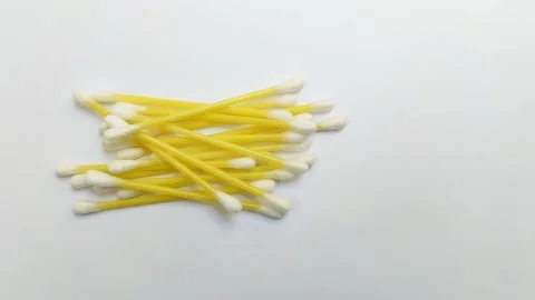 A pile of cotton buds on a white background Stock Footage 312909298