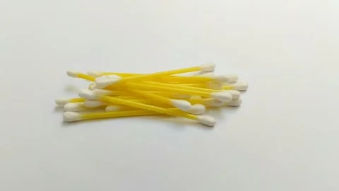 A pile of cotton buds on a white background Stock Footage 312909299