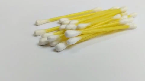 A pile of cotton buds on a white background Stock Footage 312909331
