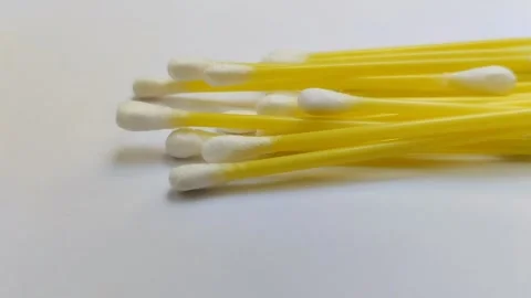 A pile of cotton buds on a white background Stock Footage 312909353