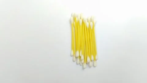 A pile of cotton buds on a white background Stock Footage 312909365