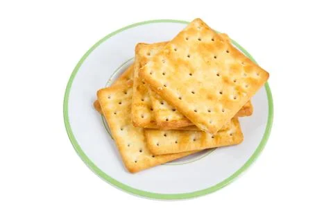Pile of crackers on plate. Stock Photos