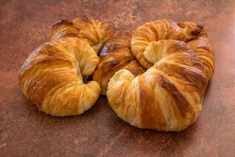 Pile of croissants close-up on a table Stock Photos
