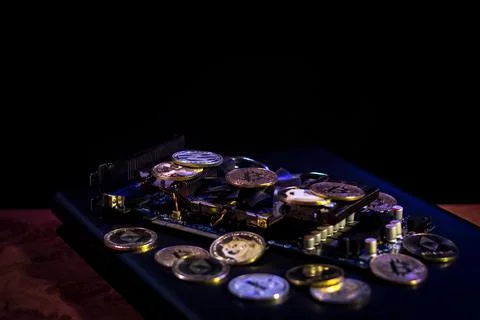 Pile of cryptocurrencies on videocard Stock Photos