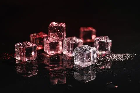 Pile of crystal clear ice cubes on black background Foto stock
