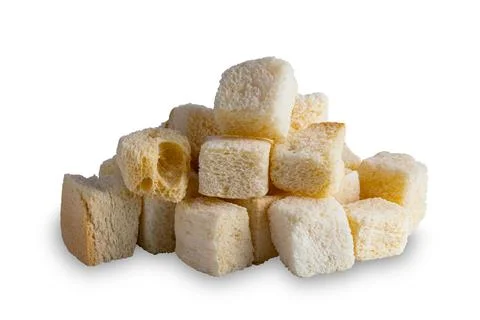 Pile of cube shape crispy croutons bread isolated on white background. Stock Photos