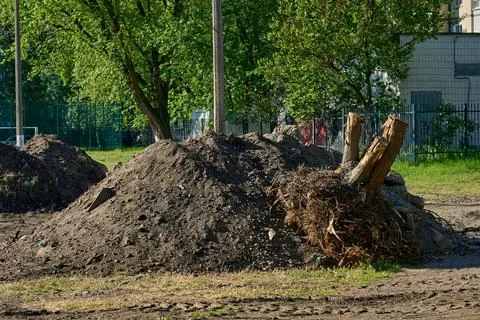 Pile debris garbage.Remove earthen ground before laying asphalt Photos