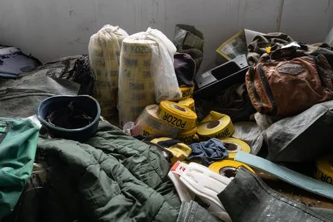 Pile of demining warning tape rolls Stock Photos