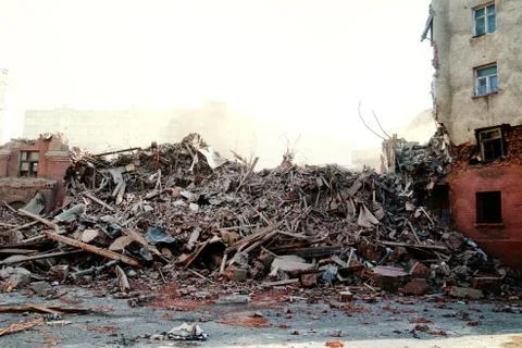 Pile of demolition rubble. Gray rubble at a building site. Demolition of a house Stock Photos