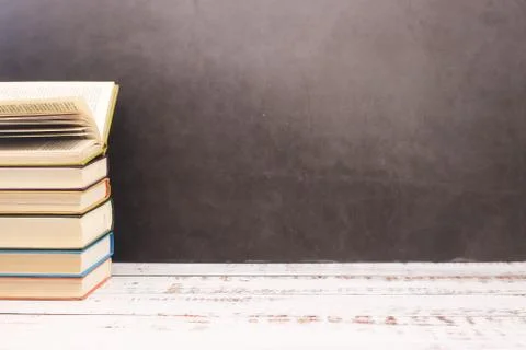 Pile of different books on the table Stock Photos