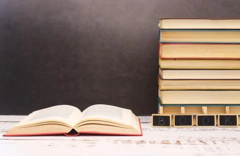 Pile of different books on the table Stock Photos