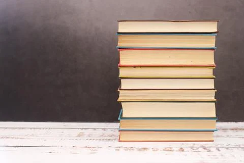 Pile of different books on the table Stock Photos