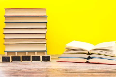 Pile of different books on the table Stock Photos