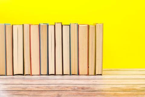 Pile of different books on the table Stock Photos