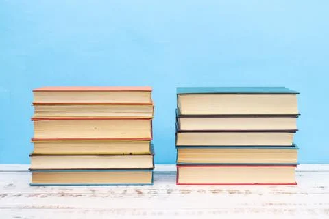 Pile of different books on the table Stock Photos