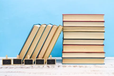 Pile of different books on the table Stock Photos