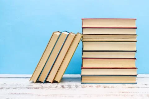 Pile of different books on the table Stock Photos