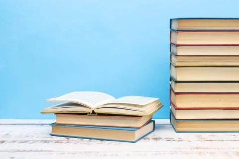 Pile of different books on the table Stock Photos