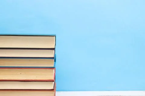 Pile of different books on the table Stock Photos