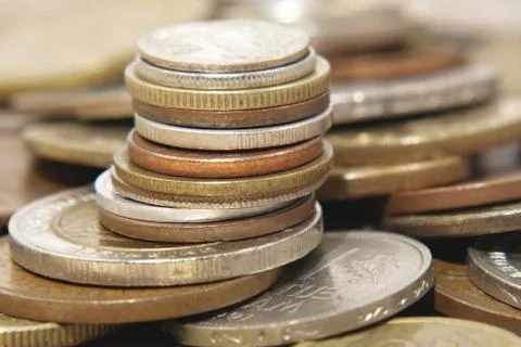 Pile of different coins. Stock Photos