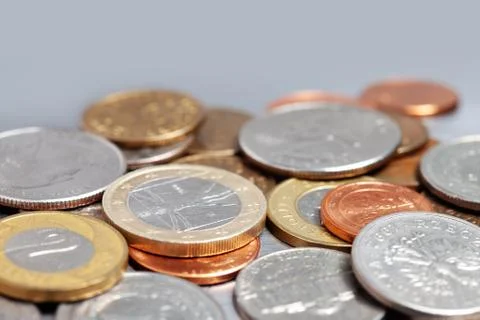 Pile of different coins Stock Photos