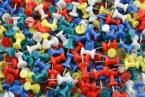 Pile of different collor pushpins Stock Photos