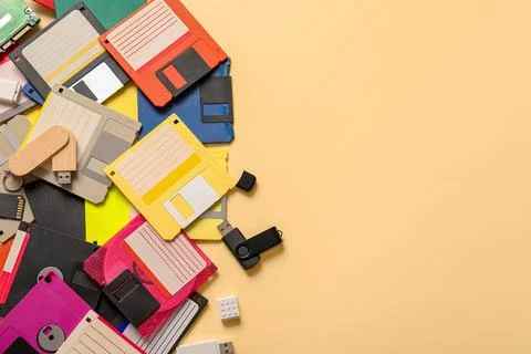 Pile of different memory storage devices on beige background Stock Photos