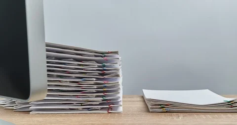 Pile document overload with computer on wood table time lapse Stock Footage 112965578