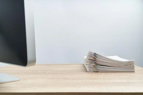 Pile of document report and computer on wooden table Stock Photos