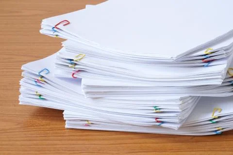 Pile of documents with colourful clips Foto stock