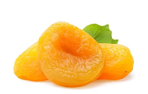 Pile of dried apricots with a leaf close-up on a white background. Isolated Stock Photos