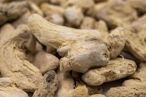 Pile of Dried Ginger root as background, spice or seasoning as background. Cl Stock Photos