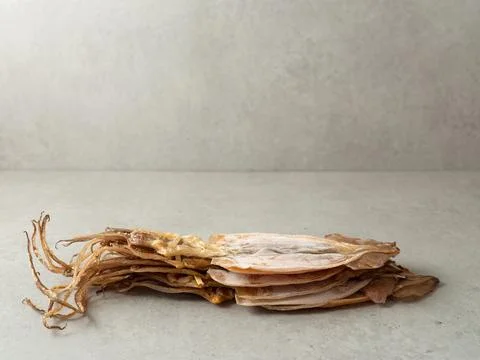 Pile of dried squid on marble background Stock Photos