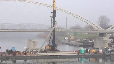 Pile driver on board the barge . New bridge construction site. 4348 Stock Footage 147262591
