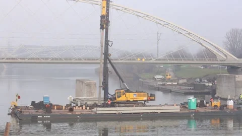 Pile driver on board the barge. New bridge construction site. 4350 Vidéo 147262616