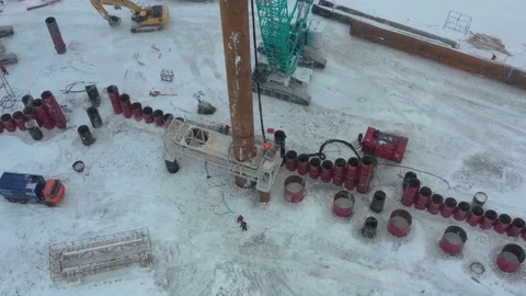 The pile driver drives the pile into the ground. Stock Footage 153469205