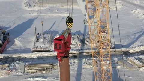 The pile driver drives the pile into the ground. Stock Footage 154202576